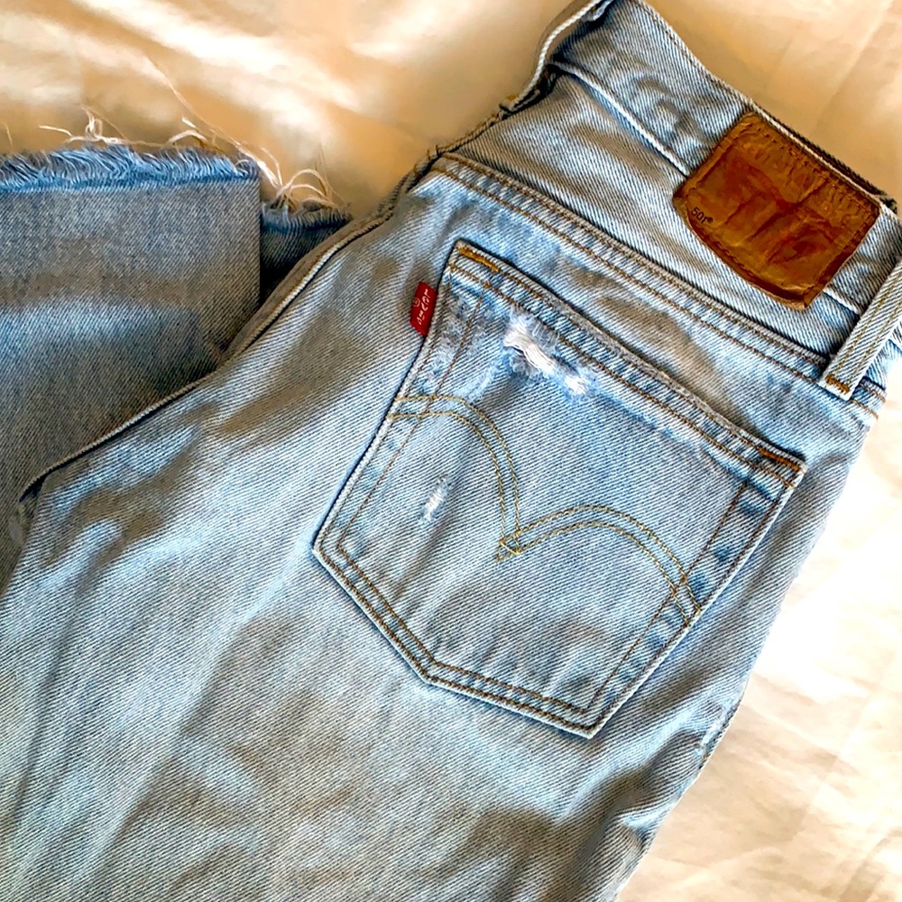 Levi’s 501 ripped knee, raw hem classic fit jeans